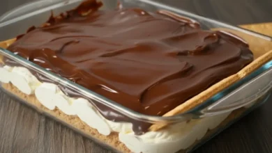 No-Bake Chocolate Eclair Cake in a glass plate