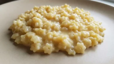 Creamy pastina recipe made with tiny star-shaped pasta, butter, and cheese, served warm on a simple plate