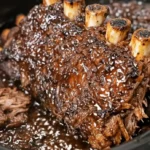 Cola ribs slow cooker recipe with tender pork ribs coated in rich, glossy cola sauce, slow cooked until fall-off-the-bone