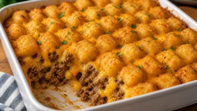 Cheesy tater tot casserole baked golden brown with crispy topping and ground beef
